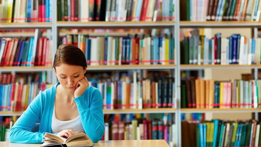 woman reading in a library
